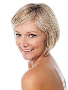 Woman with short hair, smiling.